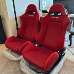 Red Recaro seats with rails